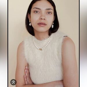 Elegant Cream Sleeveless Sweater